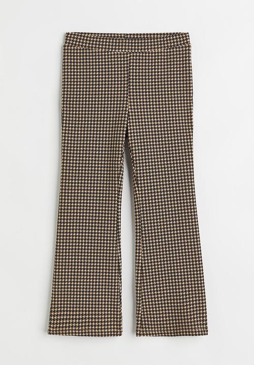 H&M - Flared leggings - beige/dogtooth-patterned