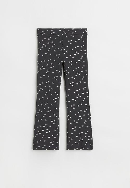 H&M - Flared leggings - black/hearts
