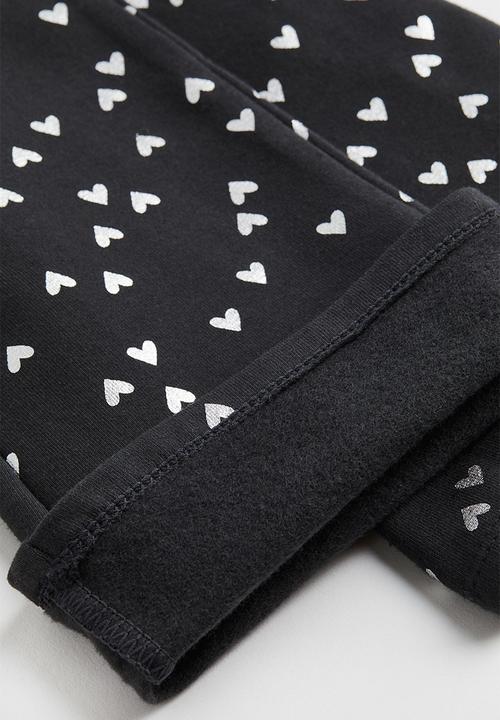 H&M - Flared leggings - black/hearts
