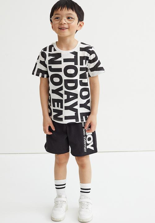 H&M - Jersey shorts - black/enjoy today