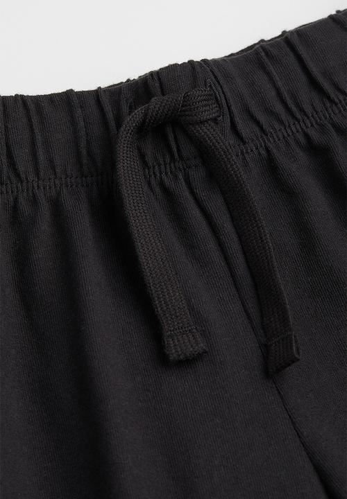 H&M - Jersey shorts - black/enjoy today