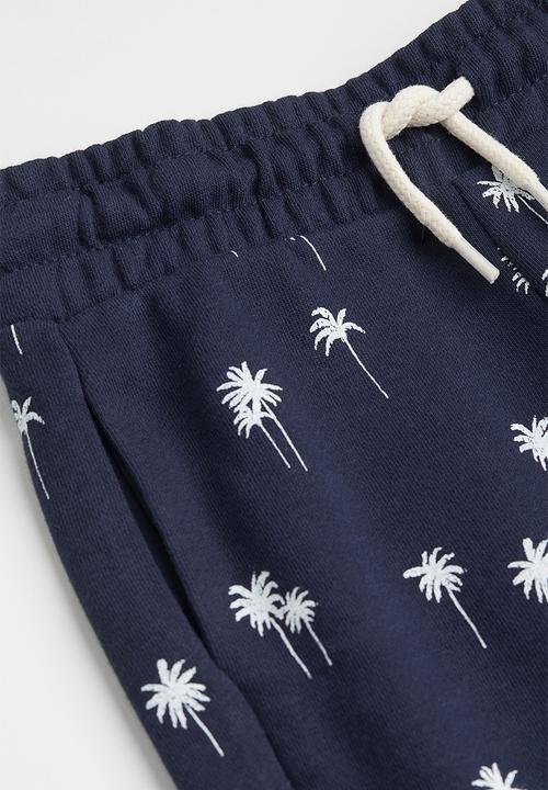 H&M - Sweatshirt shorts - navy blue/palm trees