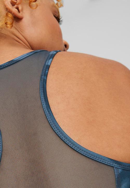 PUMA - Mid impact 4keeps graphic bra pm - dark night