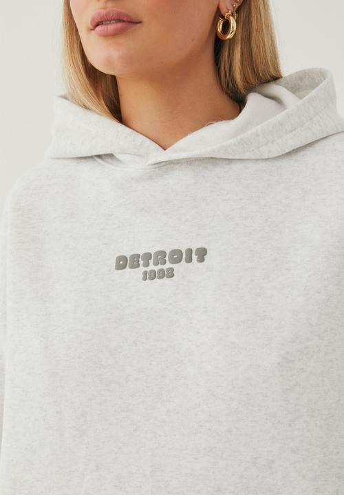 Supré  - Paige oversized printed hoodie - light grey marle/detroit
