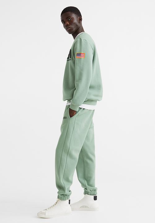 H&M - Relaxed fit sweatpants -  light green/nasa