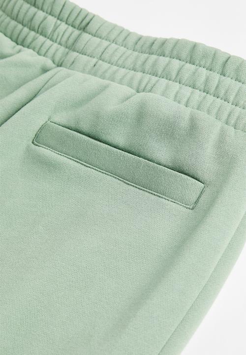 H&M - Relaxed fit sweatpants -  light green/nasa