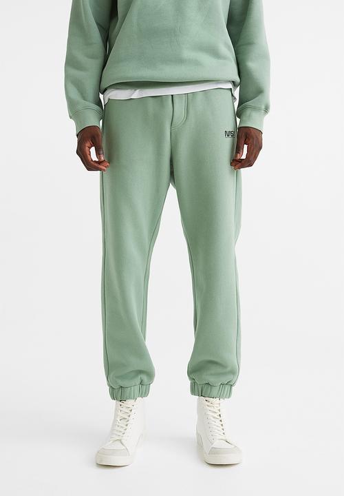 H&M - Relaxed fit sweatpants -  light green/nasa
