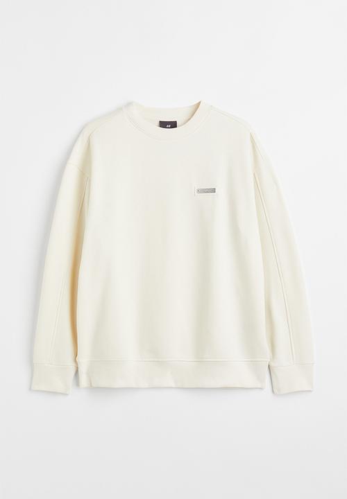 H&M - Relaxed fit appliquéd sweatshirt - cream