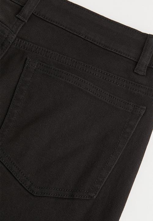 H&M - Low waist flared twill trousers - black