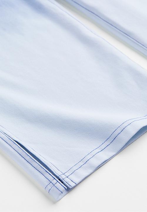 H&M - Wide fit trousers - denim blue/ombre