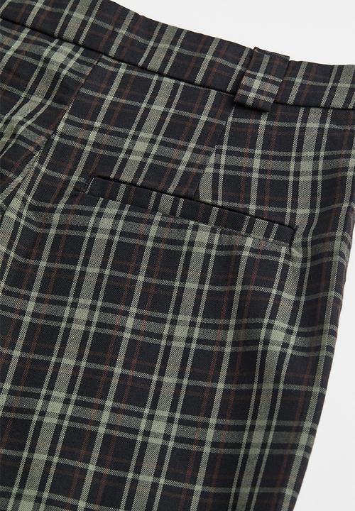 H&M - Flared tailored trousers - black/checked
