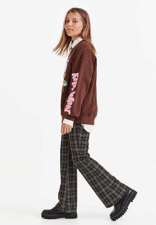H&M - Flared tailored trousers - black/checked