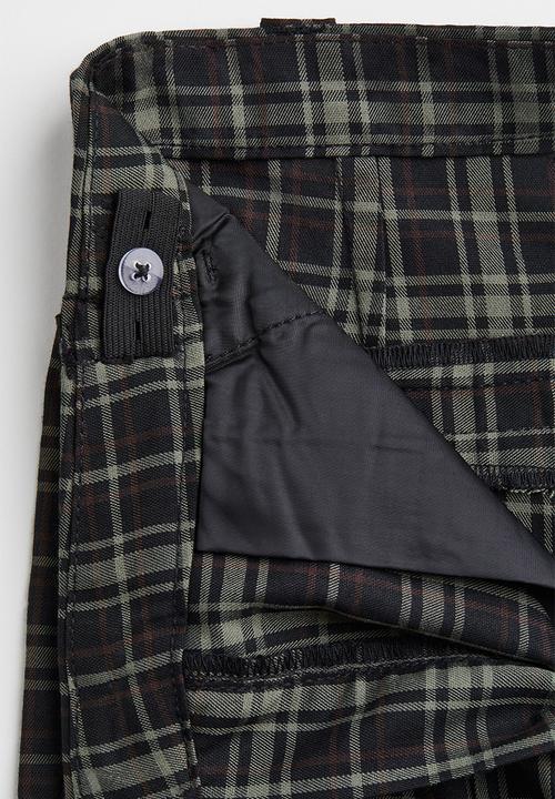 H&M - Flared tailored trousers - black/checked