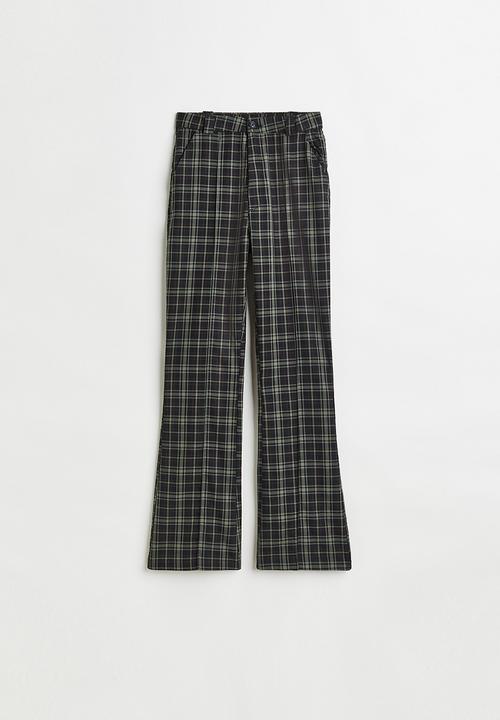 H&M - Flared tailored trousers - black/checked