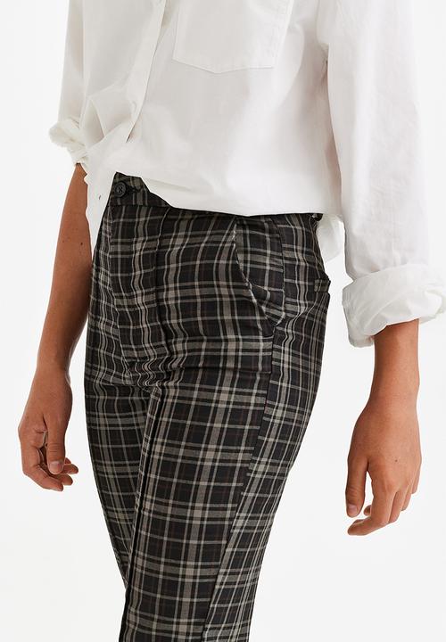 H&M - Flared tailored trousers - black/checked