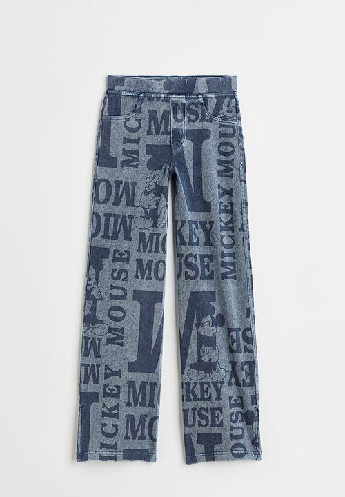 H&M - Wide printed jeggings - denim blue/mickey mouse