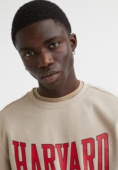 H&M - Regular fit printed sweatshirt - beige/harvard university