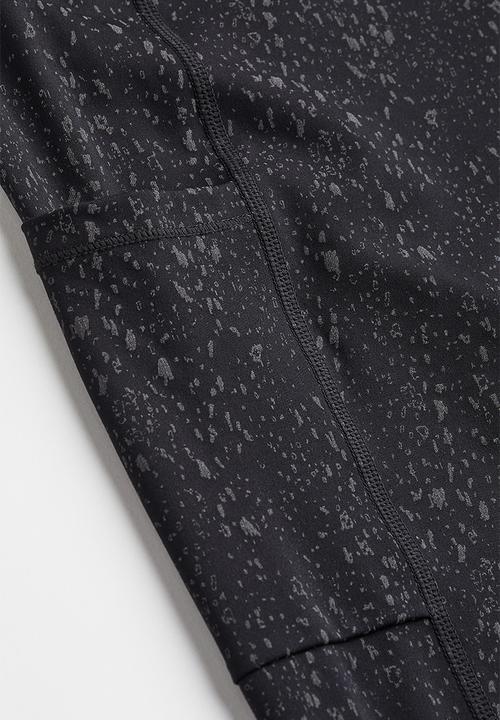 H&M - Reflective running tights - black/patterned