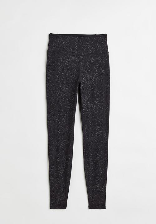 H&M - Reflective running tights - black/patterned