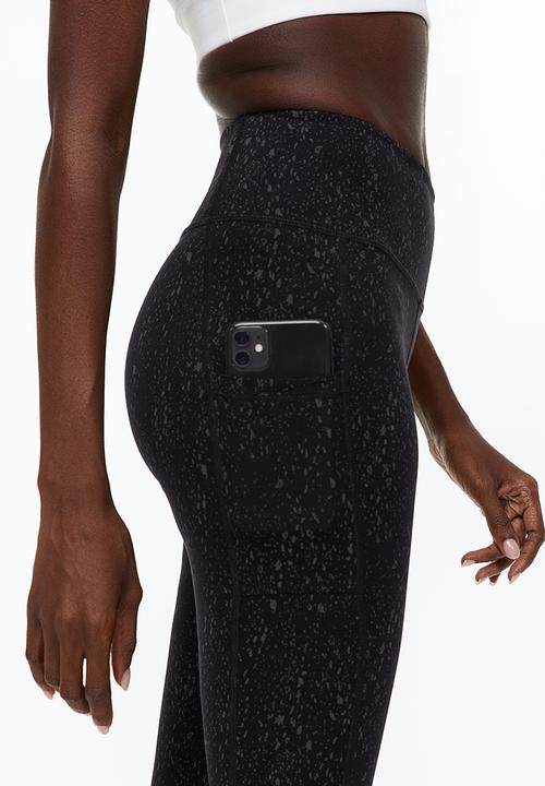 H&M - Reflective running tights - black/patterned