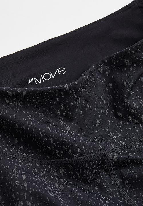 H&M - Reflective running tights - black/patterned
