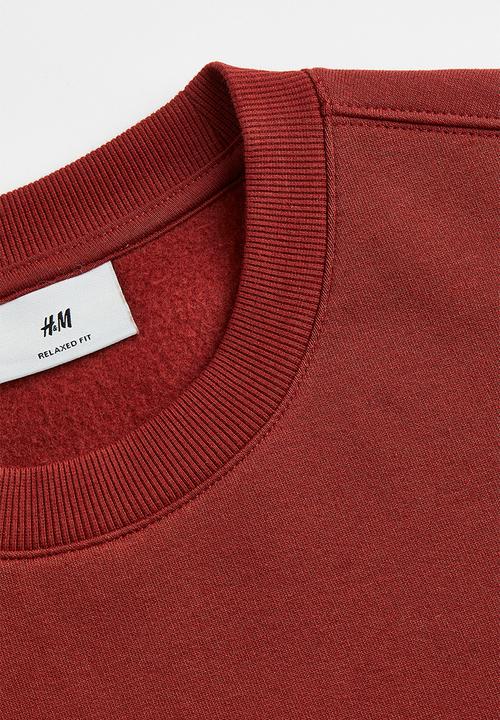 H&M - Relaxed fit printed sweatshirt - rust orange/do good