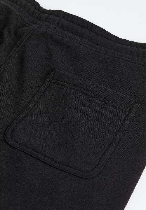 H&M - Relaxed fit sweatpants - black/new york lights