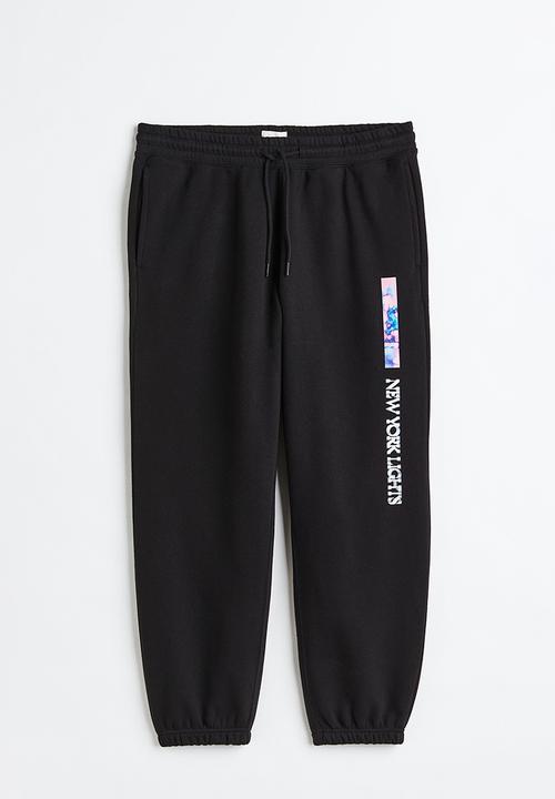 H&M - Relaxed fit sweatpants - black/new york lights