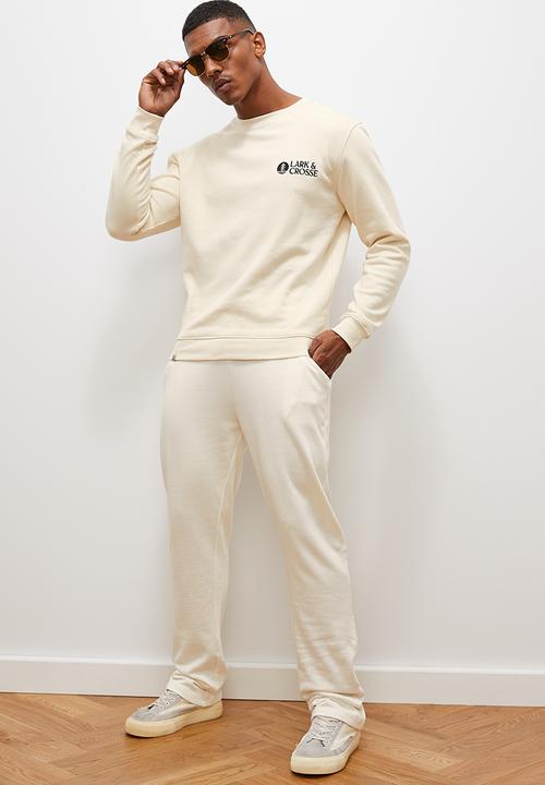 Lark & Crosse - Regular tapered open hem sweatpants - ecru
