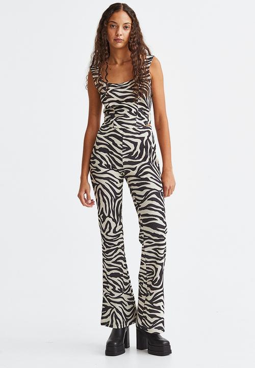 H&M - Glittery flared leggings - black/zebra print