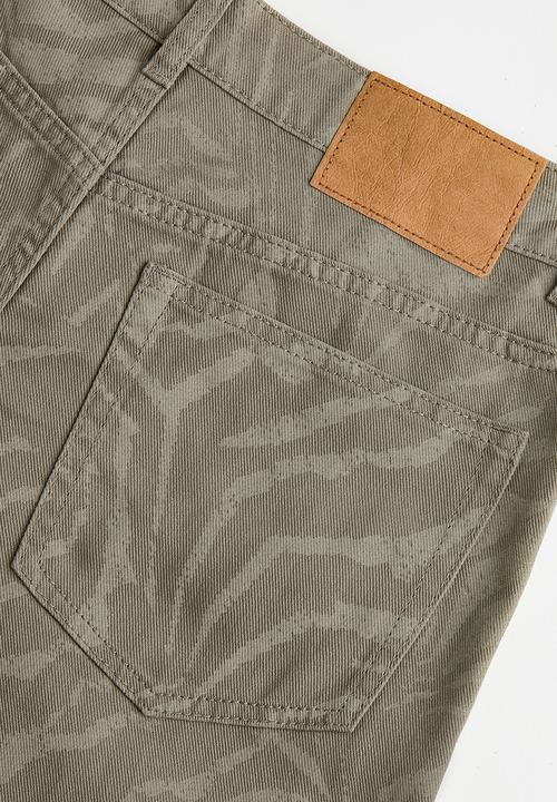 H&M - Wide twill trousers - khaki green/patterned 