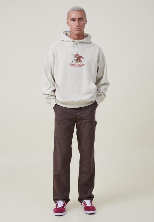 Cotton On - Budweiser oversized fleece hoodie - lcn bud ivory/a & eagle 