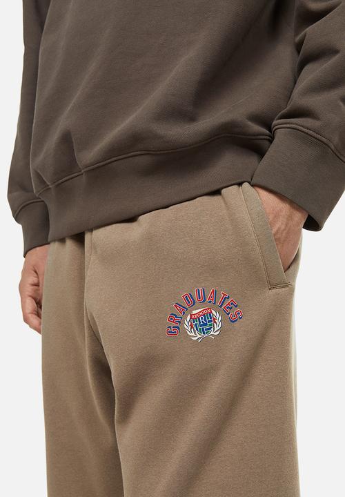 H&M - Relaxed fit printed sweatpants - beige/graduates