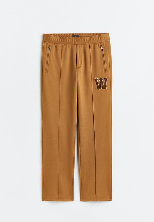 H&M - Regular fit dressy joggers - dark beige/w