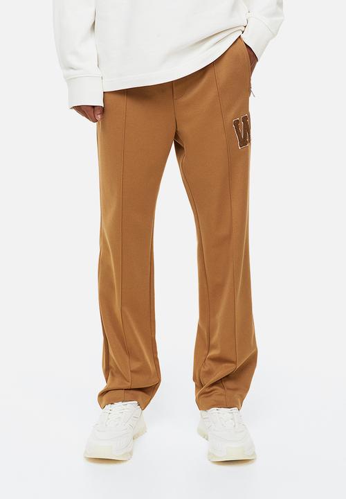 H&M - Regular fit dressy joggers - dark beige/w