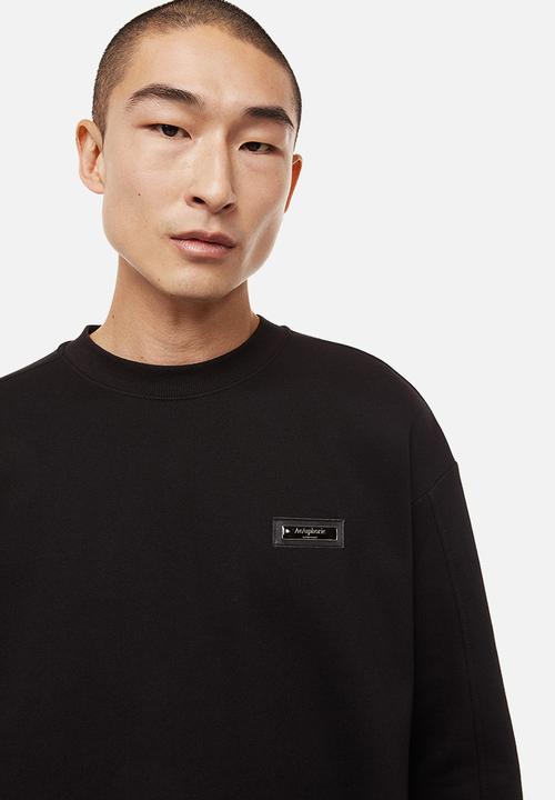 H&M - Relaxed fit appliquéd sweatshirt - black