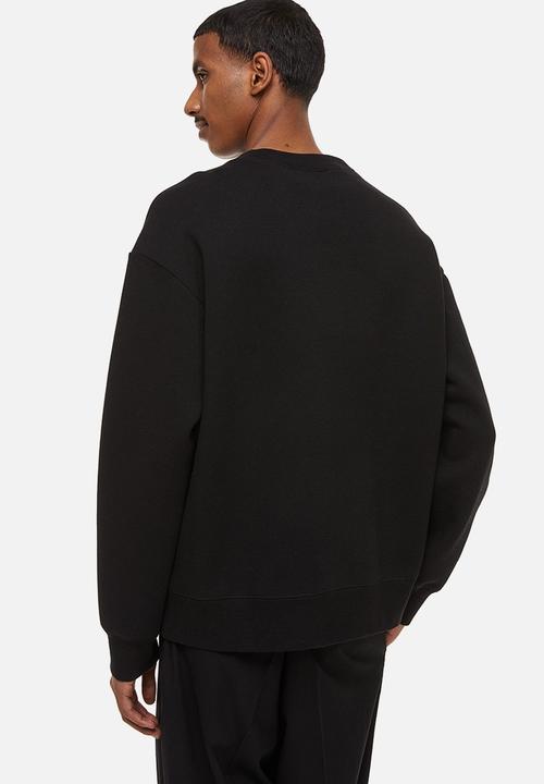 H&M - Relaxed fit printed sweatshirt - black/roses