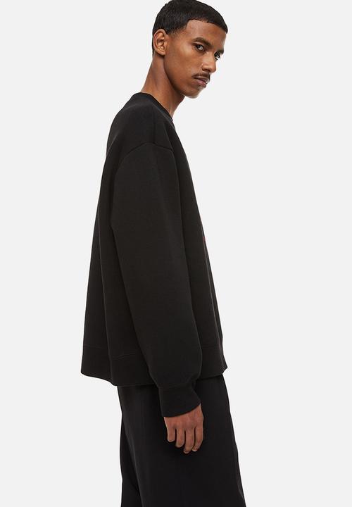 H&M - Relaxed fit printed sweatshirt - black/roses