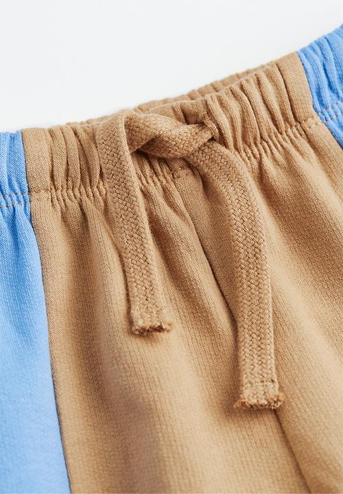 H&M - Cotton joggers - light beige block-coloured 