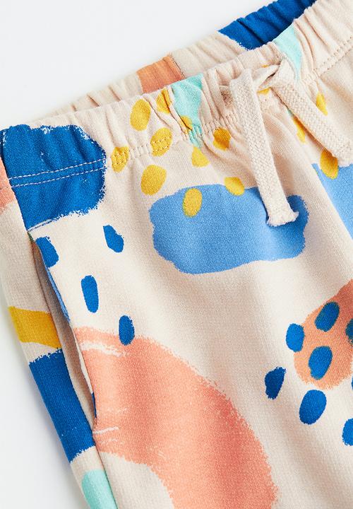 H&M - Cotton joggers - light beige/patterned