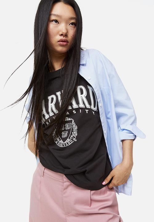 H&M - Oversized printed t-shirt - black/harvard