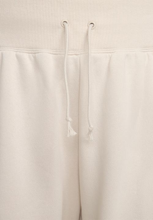 Nike - Nike Plus Women's Phoenix Fleece Pant - lt orewood brn/sail