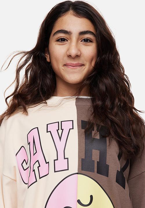 H&M - Oversized printed sweatshirt - cream/smileyworld®