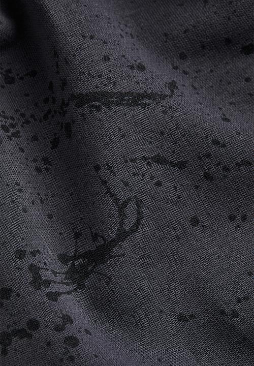H&M - Printed joggers - dark grey/splatter print