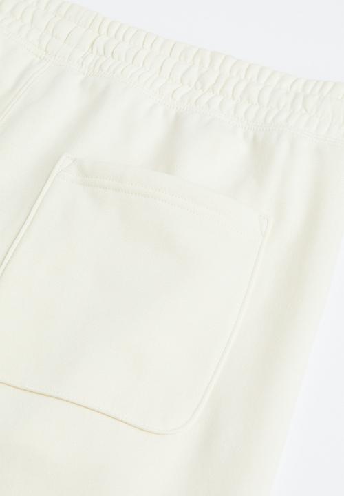 H&M - Regular fit sweatpants - cream/felix the cat 