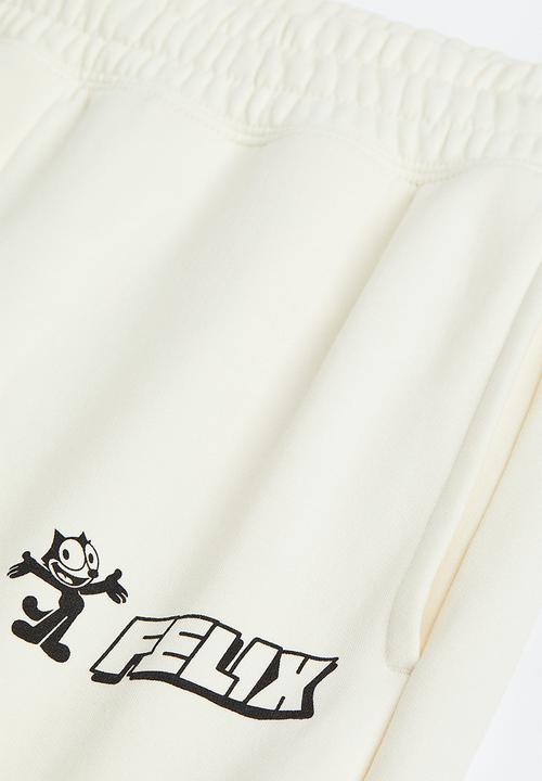 H&M - Regular fit sweatpants - cream/felix the cat 