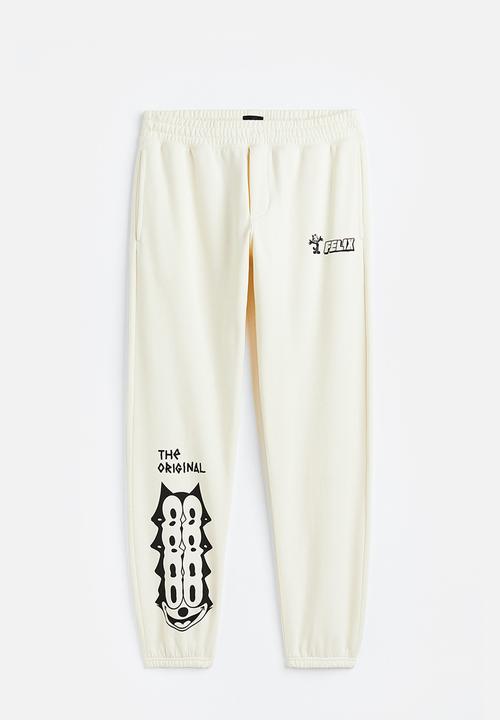 H&M - Regular fit sweatpants - cream/felix the cat 