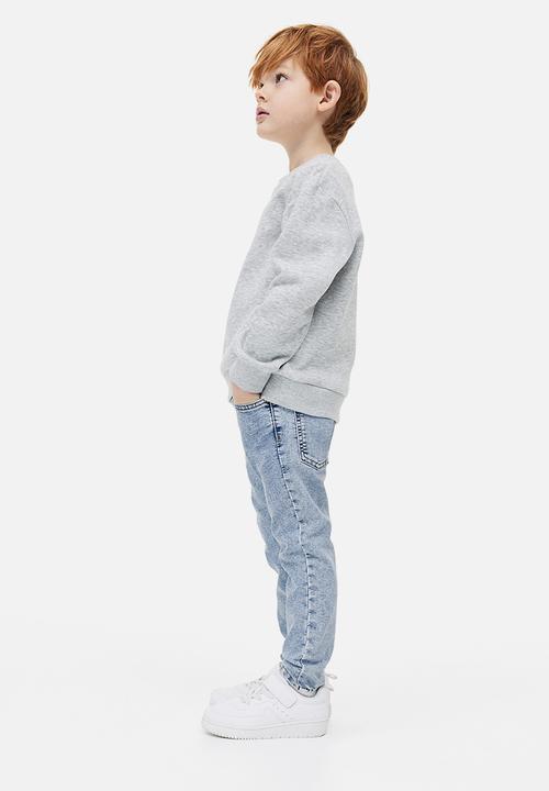 H&M - Relaxed tapered fit jeans - light denim blue 