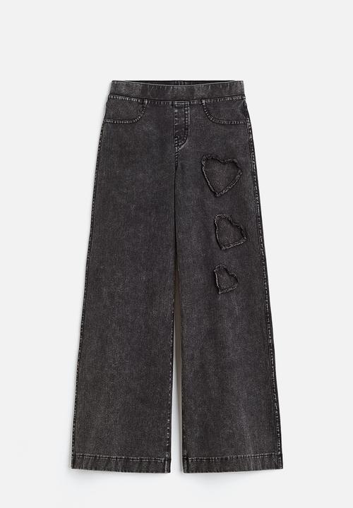 H&M - Wide trousers - black/hearts 