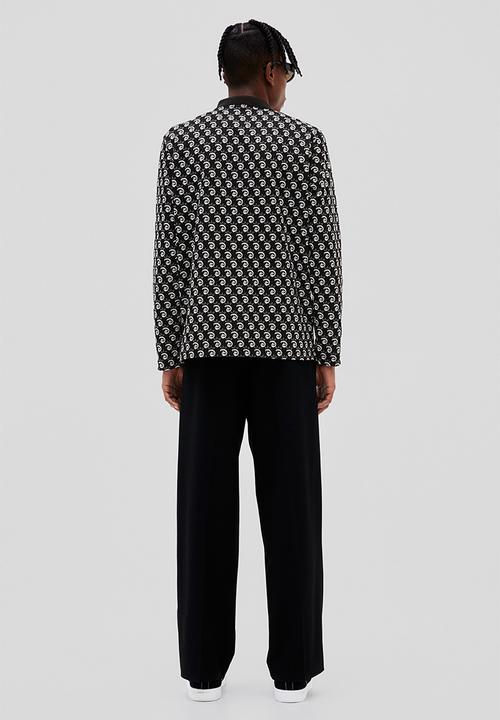 H&M - Regular fit jacquard-knit polo shirt - black/disney100
